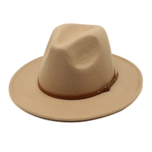 Detailed texture of khaki wool felt fedora hat with brown leather band and metal buckle