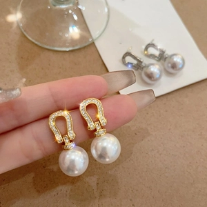 18K gold plated horseshoe earrings with zircon accents and large white dangling pearls