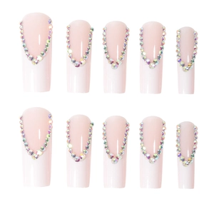 Long coffin french fake nails in soft pink with sparkling V-shaped rainbow rhinestones