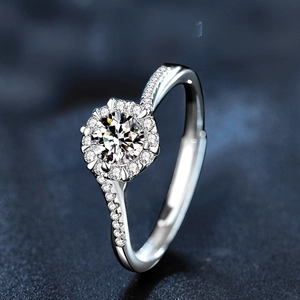 Detailed close-up of a snowflake sterling silver ring with brilliant moissanite stone