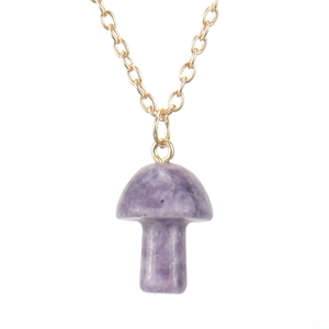 Macro detail of natural purple stone mushroom pendant on delicate golden chain necklace