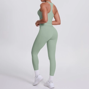 Detail of sage green yoga set showing side pocket on high-waist leggings and ribbed texture