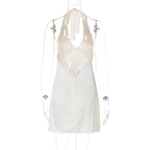 Detailed close-up of cream white backless satin nightdress with delicate lace trim edges