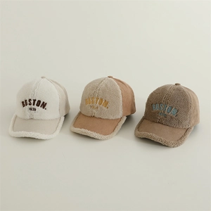 Detail of three lamb wool and corduroy baseball caps with Boston 1636 embroidery texture