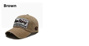 Detail of vintage washed cotton baseball cap in brown with American embroidery