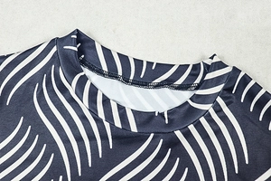 Close-up of high-elastic knit turtleneck with navy wave print and double-stitch neckline