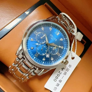 Detail of ORUSS men's silver steel watch with blue dial inside a premium gift box