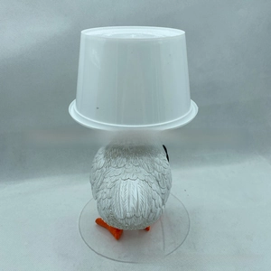 Detailed view of novelty white chicken night light with realistic resin feather texture