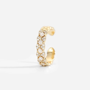 Close-up of 18K gold plated brass ear cuff with sparkling zircon lattice on white background