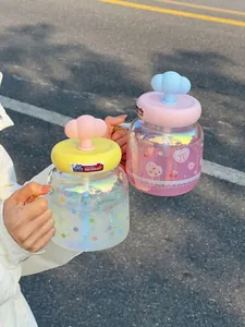 Iridescent glass tumbler with a 3D cloud lid and colorful polka dots and strawberry patterns