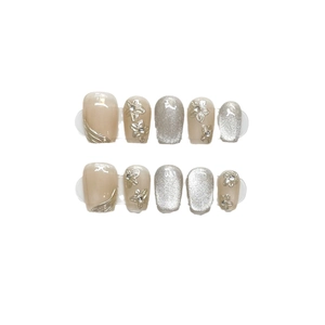 Cat eye press-on nails set with 3D metallic flowers and silver glitter details