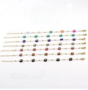 Detail of colorful beaded flower charms on adjustable golden stainless steel chain