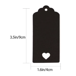 Detail view of black heart cutout cardstock tag showing dimensions 9cm by 4cm