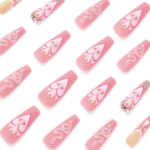 Matte pink long coffin press-on nails with white snake patterns and sparkling rhinestones