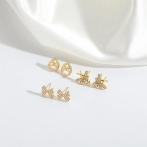 Three-piece gold stud earring set featuring bee, butterfly, and hollow flower patterns