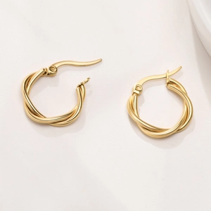 Detailed close-up showing twisted rope texture on gold minimalist stainless steel hoop earrings