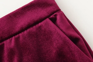 Detailed macro view of the premium burgundy velvet fabric and seamless pocket stitching