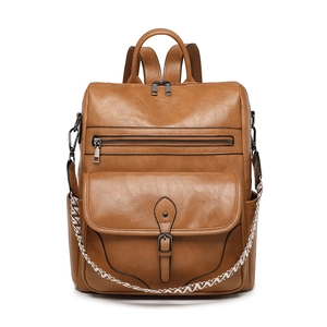 Retro brown leather backpack for women with vintage ethnic strap and multiple zip pockets