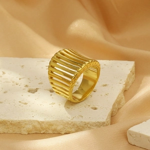 Detail of 18K gold-plated stainless steel wide ring with geometric hollow stripe design