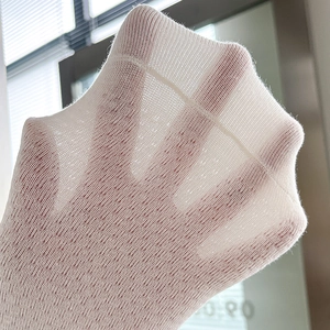 White breathable mesh socks with ruffled trim and bow detail shown in natural light