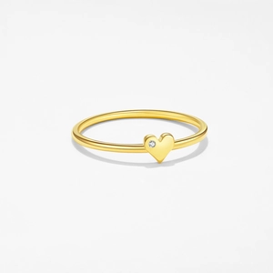 Close-up of a minimalist gold ring featuring a heart-shaped design and a tiny sparkling diamond