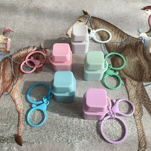 Mechanical keyboard switch fidget toys in five pastel colors with matching keychains