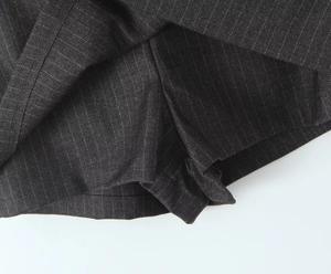 Detail view of the gray striped skort showing the built-in safety shorts and lining fabric