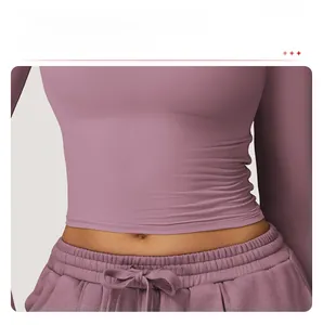 Close-up of high-waist yoga pants with drawstring and slim-fit athletic long sleeve top