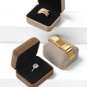 Premium velvet jewelry box for rings in light tan and dark brown with golden ribbon decor