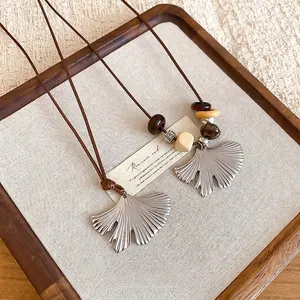 Ethnic stainless steel ginkgo leaf necklace with wood beads and dark brown wax cord