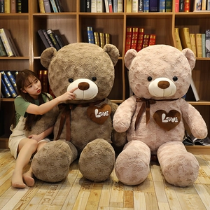 Detail of giant rose-textured teddy bears in pink and brown with Love heart patches