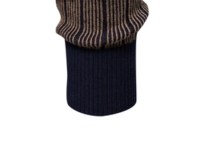 Detailed macro view of navy and brown striped ribbed cuffs on a men's knit sweater