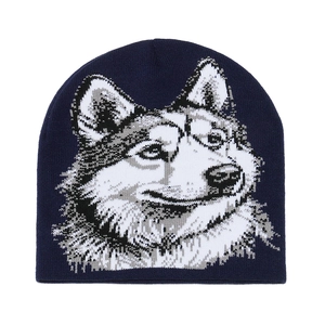 Detail of navy blue winter beanie featuring a knitted husky wolf animal head pattern