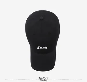 Top view of a black cotton baseball cap with white Seattle embroidery detail