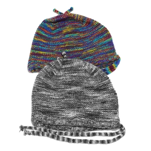 Detail of chunky knit beanies in rainbow and grey-black marl patterns with top knots