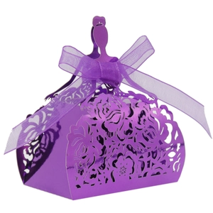 Macro view of purple laser-cut candy box with princess dress shape and ribbon bow