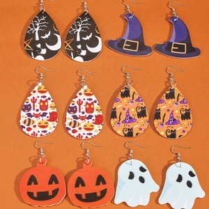 Eight pieces of Halloween themed earrings featuring pumpkin, ghost, and witch hat designs