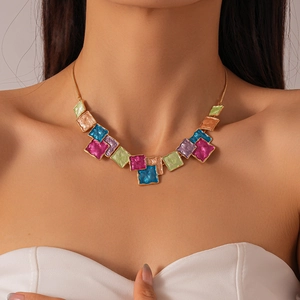 Close-up of bohemian colorful geometric square enamel necklace on model's neck