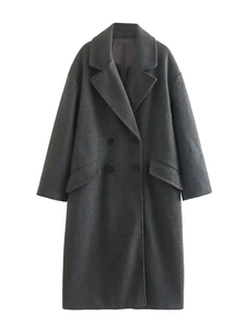 Detail of dark grey wool coat with double-breasted buttons and classic notched lapels