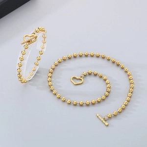 Golden bead necklace and bracelet set with heart pendant and OT toggle clasp
