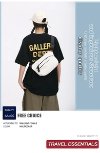 Close-up of a white crossbody bag with black zipper and adjustable wide shoulder strap