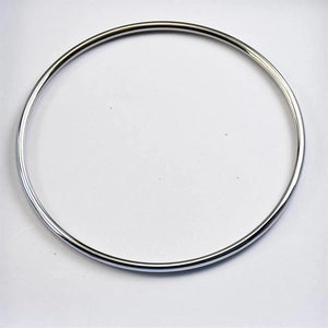 Macro shot of polished 2mm silver titanium steel bangle with reflective mirror finish