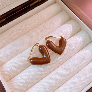 Vintage heart shaped earrings with brown enamel glaze and gold finish in a luxury box
