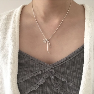 Minimalist S925 sterling silver ribbon bow pendant necklace on a delicate snake chain