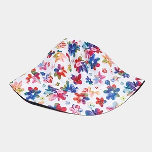 Chapeau de soleil réversible avec motif floral coloré sur tissu en coton blanc