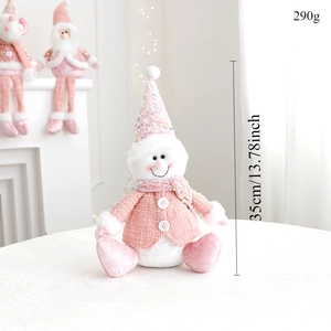 Detail of pink sequin snowman plush toy showing 35cm height and soft fabric texture