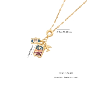 Detailed travel necklace featuring enamel luggage, gold camera, and airplane charms