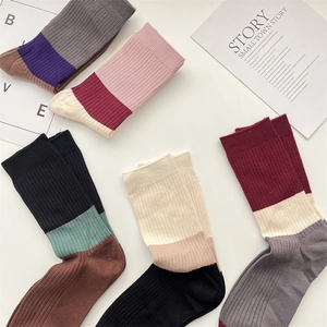 Close-up of five pairs of warm cashmere-feel ribbed crew socks with retro color blocking