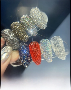 Detail showing eight colors of iridescent nail art sequins and micro beads in containers