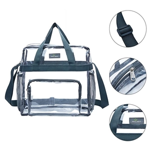Detail view of large clear PVC travel bag showing shoulder strap buckle and zipper seams